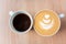Two cups of coffee, different choice: black or white, espresso or capuchino, americano or latte
