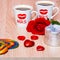 Two cups of coffee, rose flower, gift and lollipop