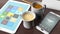 Two cups with coffee, tablet, smartphone,notepad and pencil