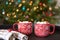 Two cups of hot chocolate in front of the Christmas tree