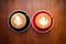 Two cups of hot coffee with latte art on wooden table. Favorite beverage of caffein drink