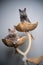 two curious british shorthair kittens resting on scratching post together