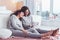 Two curly-haired sisters feeling rested watching movie