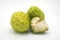 Two custard apples and one half custard apple, isolated on background.