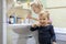 Two cute adorable blond caucasian siblings washing face and cleaning tooth with toothbrush at bathroom at home in