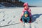 Two cute adorable funny sibling kid frined wear warm jacket enjoy have fun sledging at frozen white snow lake edge