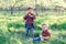 Two cute brother boys tweens having fun outside at sunset in the country