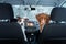 Two cute dogs in the car on the seat look. A trip with a pet. Nova Scotia Duck Tolling Retriever and a Jack Russell Terrier