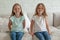 Two cute happy girls siblings portrait. Happy smiling friends family relationships. Adorable children playing together at home