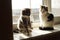 Two cute kittens play with a rope of blinds on a sunny windowsill