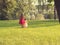 Two cute little girls in beautiful dresses having fun at sunset. Toned