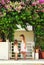 Two cute little girls talking near the house