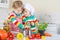 Two cute little kid boys cooking italian soup and meal with fresh vegetables