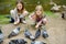 Two cute little sisters feeding birds on summer day. Children feeding pigeons and ducks outdoors