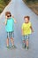 Two cute red curly boys brothers are having fun with mother sunglasses