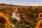 Two cute sibling boys hugging and having fun sunflowers field. Adorable friends together on warm summer day.