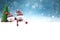 Two Cute Snowmen with blank banner on snowy landscape background