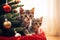 Two cute tabby kittens sisters playing together near Christmas tree, look curiously and excited, celebrating Christmas with cat