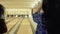 Two cute women invites cameraman to play bowling together with them