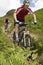 Two Cyclists On Countryside Track