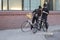 Two cyclists watching the route, stopping in the center of the city