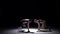 Two dancers performing and start dance breakdance on black, shadow, slow motion