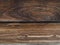Two dark brown weathered effect of a scorched wood parallel board base background
