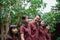 Two daughters, mother, father and grandmother join hands to enjoy a walk together