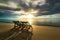 Two deckchairs on the beach at sunset with a tropical sea background. Travel and Vacation in Summer at sea