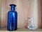 Two decorative bottles - blue and transparent