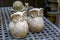 Two decorative figurines of an owl and a snail