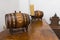 Two decorative wine barrels on a shelf