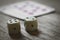 Two dice closeup on on a wooden table.