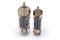 Two different old electronic vacuum tubes on a white background