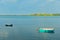 Two dinghies floating idly on calm harbour water at Tauranga New Zealand