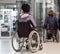 Two disabled women waiting for elevator