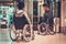 Two disabled women waiting for elevator in a store