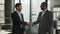 Two diverse businessmen multiracial business partners office coworkers men talking discuss negotiate project handshaking