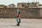 Two Djboutian brothers walking in front of a wall in Djibouti. Editorial shot in Djibouti