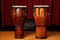 two djembe drums of different sizes, side by side