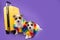 Two dogs going on vacation. Isolated on purple background