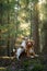 Two dogs together in the forest. Duck Retriever Jack Russell Terrier in nature. Pet friendship