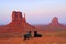 Two dogs watching the buttes at Monument Valley National Park, Arizona, U.S.A