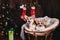 Two dogs welsh corgi pembroke in a chair. Happy holiday New Year and Christmas