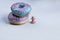 Two donuts with pink and blue glaze lie on top of each other