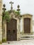 two doors on the side wall of the church of SÃ£o Bartolomeu in the city of Coimbra.