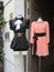 Two dresses displayed on the street