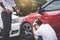 Two drivers man arguing after a car traffic accident collision,