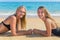 Two dutch girls lying on beach
