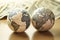 Two earth globes on a background of a pile of dollars bills money. International investment, money around world concept. Global